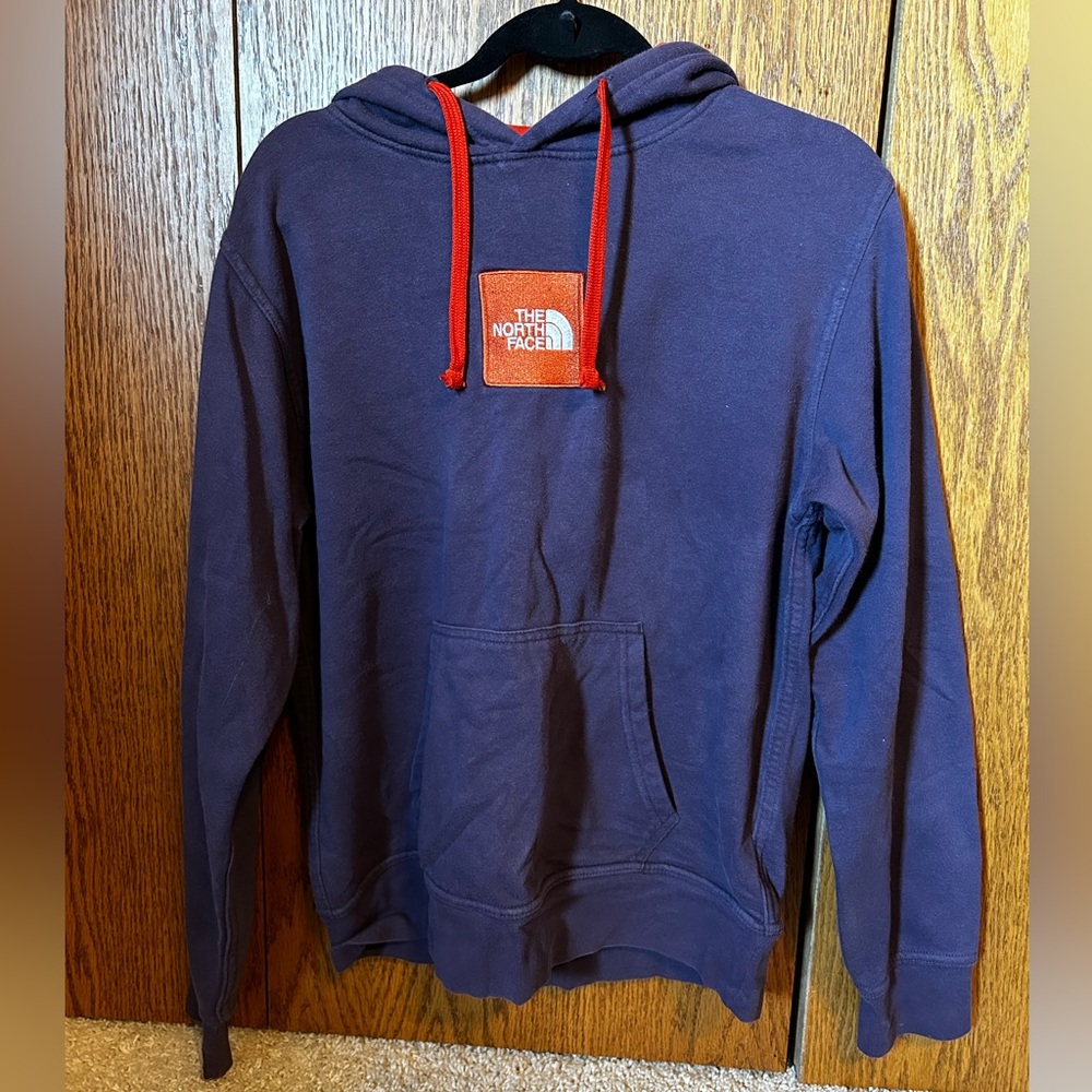 Purple and orange north face hoodie size small.